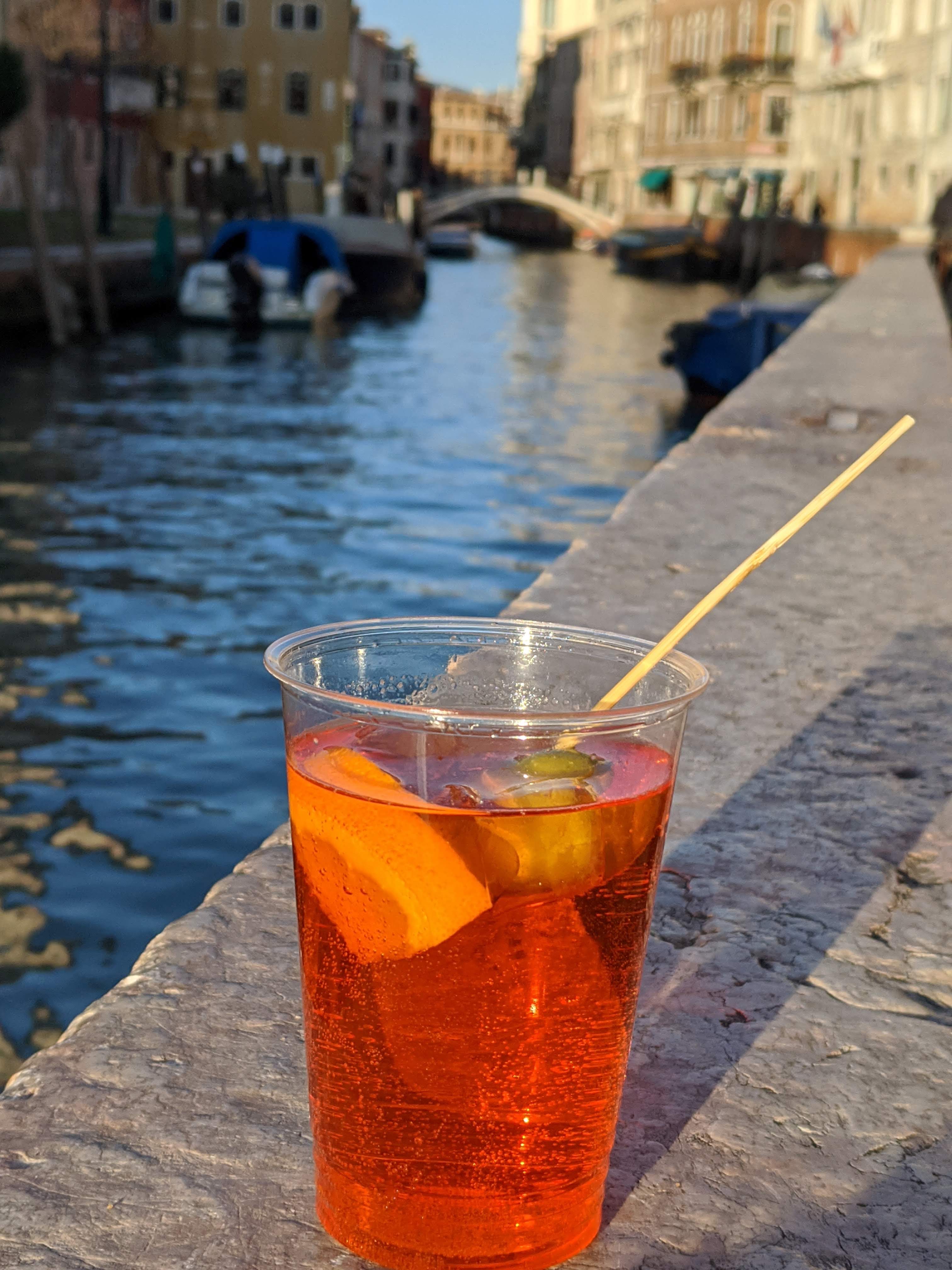 Aperol Spritz by a canal in Venice